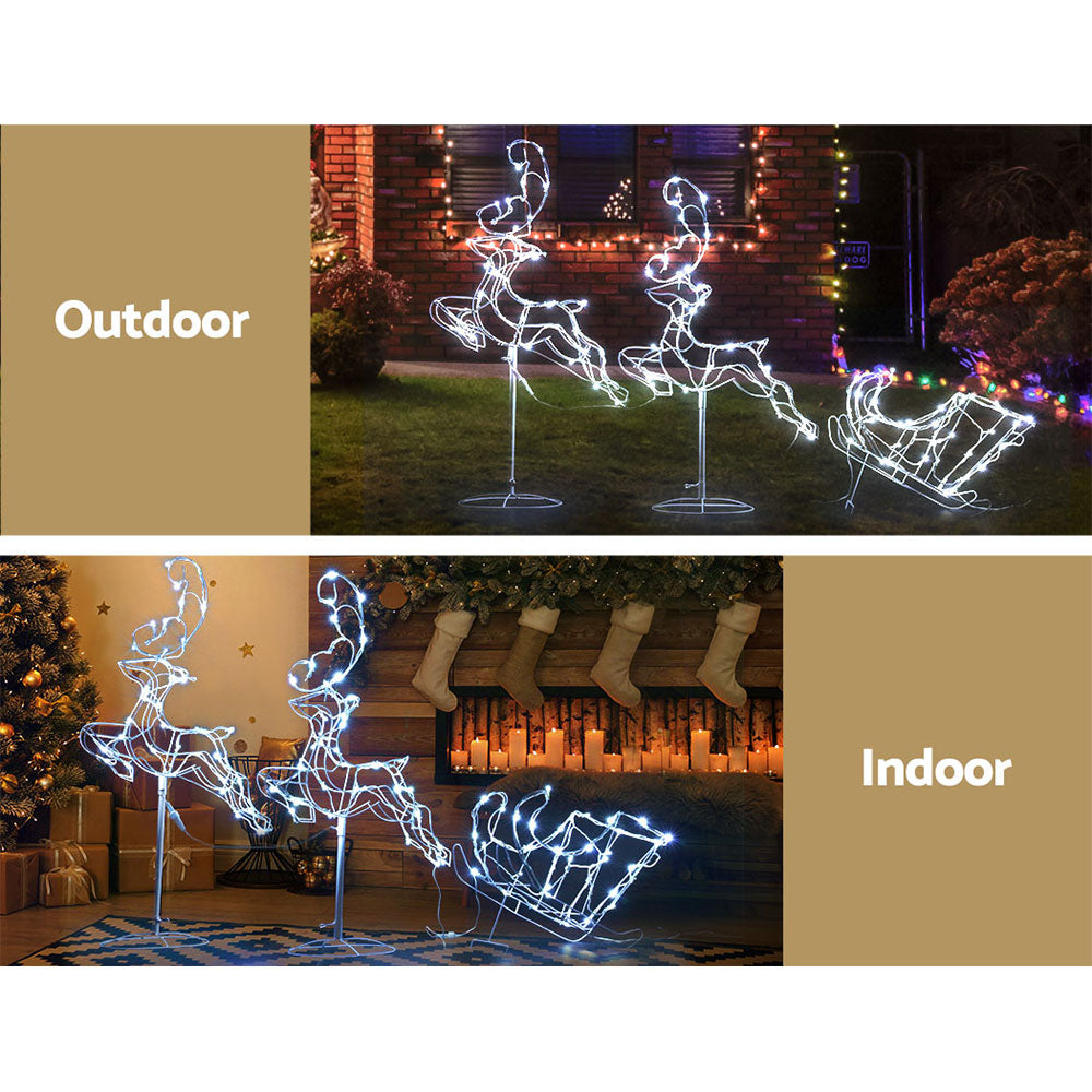 A beautiful LED rope light display featuring two reindeer pulling a sleigh, set in a sturdy white metal frame, perfect for Christmas decorations.